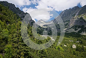 The aerial view from cableway of mountain waterfall Skok with Strbsky peak in the background, High Tatras, Slovakia