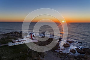 Aerial view of the Cabo Raso lighthouse near Cascais at sunset photo