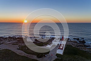 Aerial view of the Cabo Raso lighthouse near Cascais at sunset photo