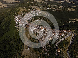 Aerial view of Cairano from above, a small township on hilltop surrounded by countryside, Irpinia, Avellino, Italy photo