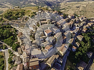 Aerial view of Cairano from above, a small township on hilltop surrounded by countryside, Irpinia, Avellino, Italy photo