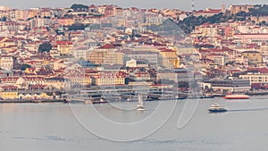 Aerial view of the Cais Do Sodre ferry terminal by the Tage river timelapse in Lisbon, Portugal photo