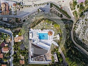 Aerial view of the Calabrian coast, cliffs overlooking the crystal clear sea and luxury villas. Riaci, Tropea, Italy