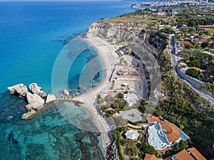 Aerial view of the Calabrian coast, villas and resorts on the cliff. Transparent sea and wild coast. Riaci rocks photo