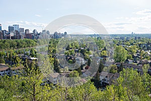 Aerial view of Calgary in springtime. Downtown, river, houses and trees. Canada