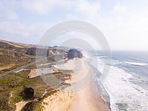 Aerial view of the Californian Pacific ocean cliffs on a cloudy day background
