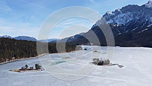 Aerial view of the calm white coast and beautiful island and mountain landscape