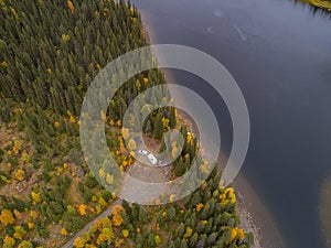 aerial view camping caravan near river autumn fall landscape along Ammarnas National Park in Lapland Sweden