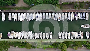 Aerial view of a canal harbor with moored boats and rafts. Foce Sisto.