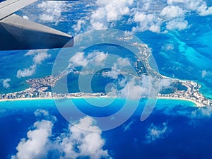 Aerial View of Cancun Hotel Zone Coastline with Airplane Wing