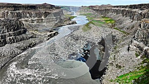 Aerial view canyon with river in Iceland. Colossal geological phenomenon. Soil erosion at highlands in summer season