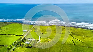 Aerial view on the Cape Egmont lighthouse on the coast of Tasman sea. Taranaki region, New Zealand