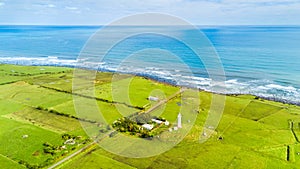 Aerial view on the Cape Egmont lighthouse on the coast of Tasman sea. Taranaki region, New Zealand