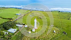 Aerial view on the Cape Egmont lighthouse on the coast of Tasman sea. Taranaki region, New Zealand