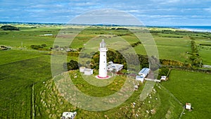 Aerial view on the Cape Egmont lighthouse on the coast of Tasman sea. Taranaki region, New Zealand