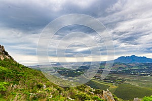 Aerial view of Cape Town from Sir Lowry`s Pass, South Africa. Winter season, cloudy and dramatic sky.