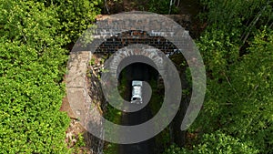 Aerial view of the car entering the tunnel