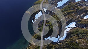 Aerial view of car on mountain road by the lake in Norway