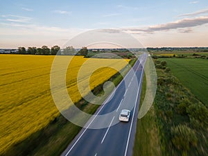 aerial view of car moving by speedway