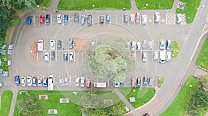 Aerial view on car park, cars parked on parking in row