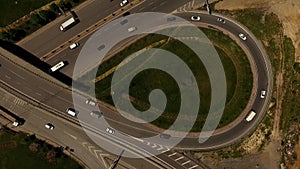 Aerial view of car traffic in highway interception in the city.