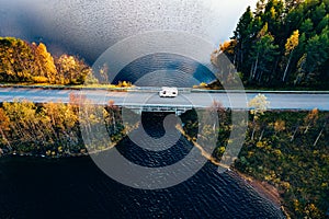 Aerial view Caravan trailer or Camper rv on the bridge over the lake in Finland