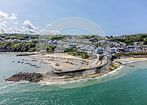 An aerial view from Cardigan Bay towards the harbour and the town at New Quay, Wales