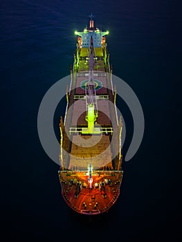 Aerial view cargo bulk carrier ship on the sea at night