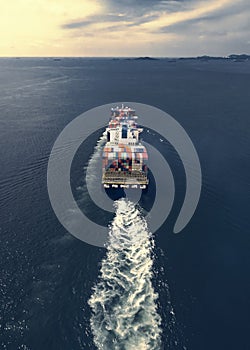 Aerial view of cargo ship, cargo container in warehouse harbor a