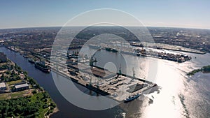 Aerial view of cargo ship, cargo container in warehouse harbor in the Morskie Vorota district in St. Petersburg