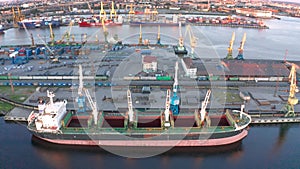 Aerial view of cargo ship, cargo container in warehouse harbor in the Morskie Vorota district in St. Petersburg