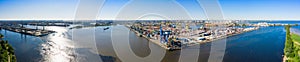 Aerial view of cargo ship, cargo container in warehouse harbor in the Morskie Vorota district in St. Petersburg