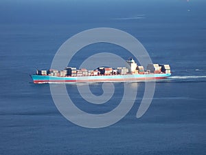 Aerial view of a cargo ship with containers