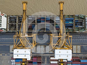 Aerial view of cargo ship at industrial port with container box