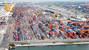 Aerial view of cargo ships loading containers at seaport