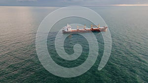 Aerial view cargo vessel sailing ocean to gloomy horizon. Tanker floating sea