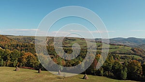 Aerial view of the carpathian mountains in autumn. Hay harvest