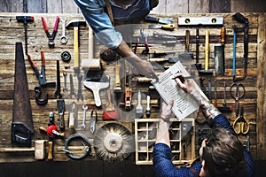 Aerial view of carpenter man listing checking tools equipment