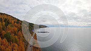 Aerial view of cars driving along the coastal road