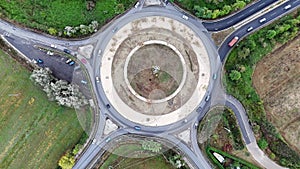 Aerial view of cars driving in a circle in city traffic. High quality 4k footage