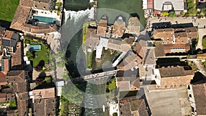 Aerial view of the cascade on the Mincio river, a picturesque place in Italy. Village of Borghetto sul Mincio in the photo