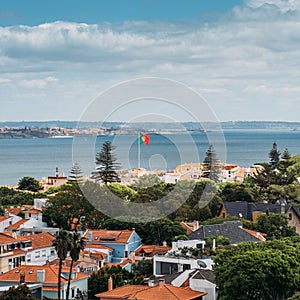 Aerial view of Cascais, Portugal Overlooking Coastal Buildings With Portuguese Flag