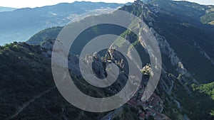 Aerial view of Castelmezzano with high mountains and the cityscape, Lucania, Basilicata, Italy