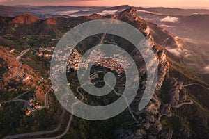 Aerial view of Castelmezzano village at sunrise in Apennines Dolomiti Lucane, Basilicata, Italy photo