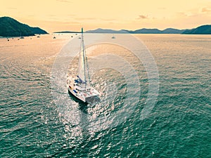 Aerial view of a catamaran on the andaman seas. Sailing in Phuket, Thailand