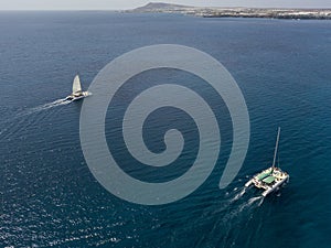 Aerial view of a catamaran crossing the ocean waters. Lanzarote, Canaries, Spain