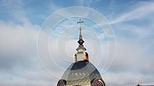 Aerial view of Cathedral blue dome with golden stars cross. Sunny day.