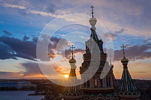 Aerial view of the Cathedral of Saints Peter and Paul, golden domes in the beautiful setting sun. Orthodox church in Peterhof.