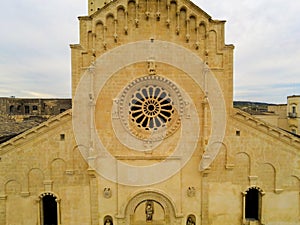 Aerial  View of the Cathedral of St. Maria La Bruna on Cloudy Sky at Sunset. Matera, Italy