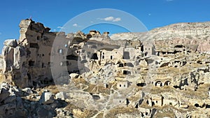 Aerial view of Cavusin-Cappadocia A lot of stone houses and churchs. ancient village Cavusin. turkey tourism trip.